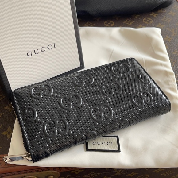 Authentic Gucci GG embossed zip around wallet case